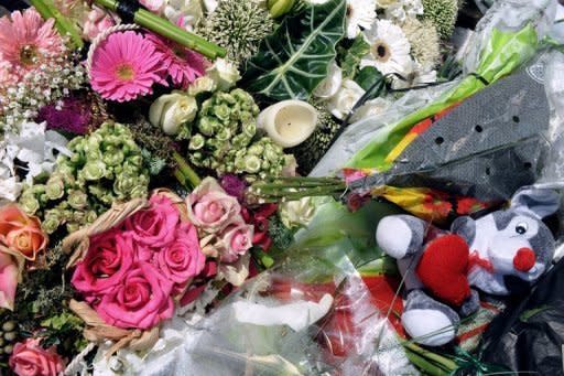 Flowers are left outside the "Ozar Hatorah" Jewish school in Toulouse, where four people were killed by Islamic extremist Mohamed Merah. French authorities have rejected charges that intelligence failures allowed Merah to kill seven people, insisting there was no evidence he was anything but a lone wolf with no ties to Al-Qaeda