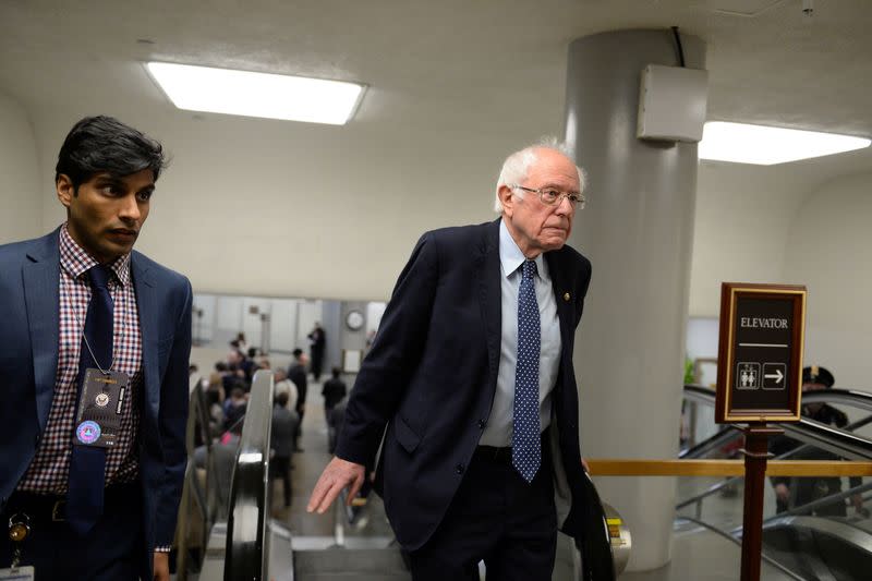 Democratic U.S. presidential candidate Sen. Bernie Sanders (D-VT) walks up the escalator from the Senate subway on his way to the Senate impeachment trial of President Donald Trump in Washington