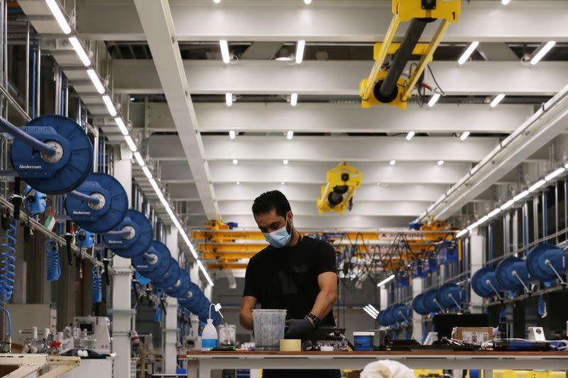 A worker is seen at the Strata Manufacturing facility, in Al Ain