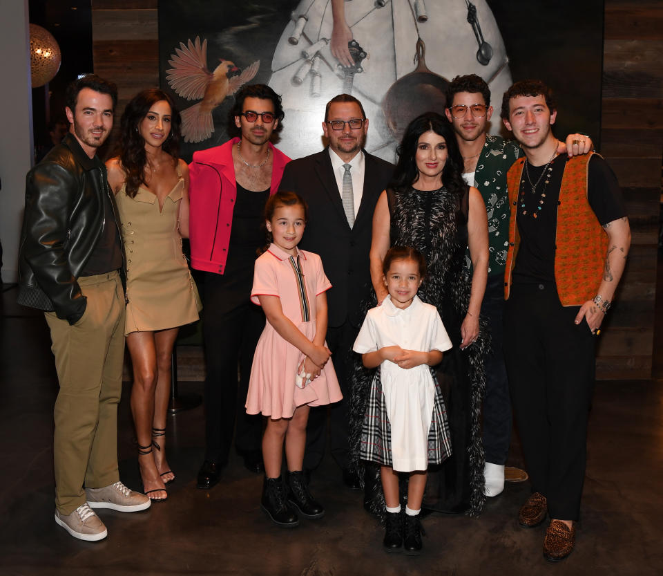 LAS VEGAS, NEVADA - JUNE 04:  Kevin Jonas, Danielle Jonas,  Joe Jonas, Kevin Jonas Sr.,  Denise Jonas, Nick Jonas, Frankie Jonas, (Bottom Row) Alena Rose Jonas and Valentina Angelina Jonas arrive at the grand opening of their family restaurant Nellie's Southern Kitchen at MGM Grand on June 04, 2022 in Las Vegas, Nevada. (Photo by Denise Truscello/Getty Images for Nellie's Southern Kitchen)