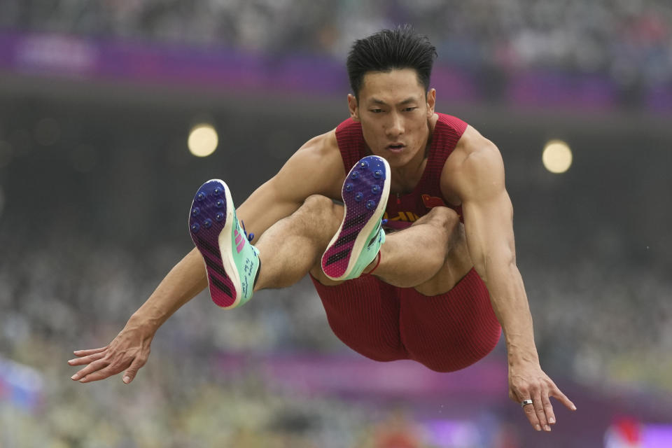 China's Shi Yuhao competes during the men's long jump qualification at the 19th Asian Games in Hangzhou, China, Saturday, Sept. 30, 2023. (AP Photo/Lee Jin-man)