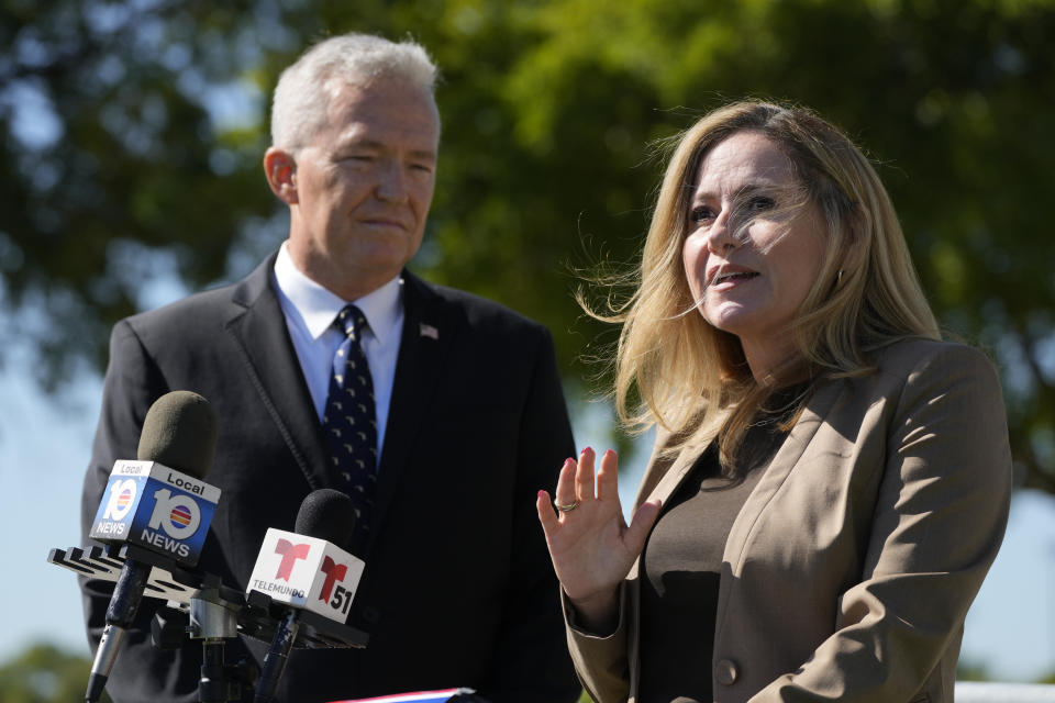 Former Rep. Debbie Mucarsel-Powell, D-Fla., right, speaks alongside Navy Cmdr. (Ret.) Phil Ehr, during a news conference at the Memorial Cubano in Tamiami Park, Wednesday, Oct. 18, 2023, in Miami. Mucarsel-Powell, who is running for a Senate seat against Republican Rick Scott, endorsed Ehr for Congress. (AP Photo/Wilfredo Lee)