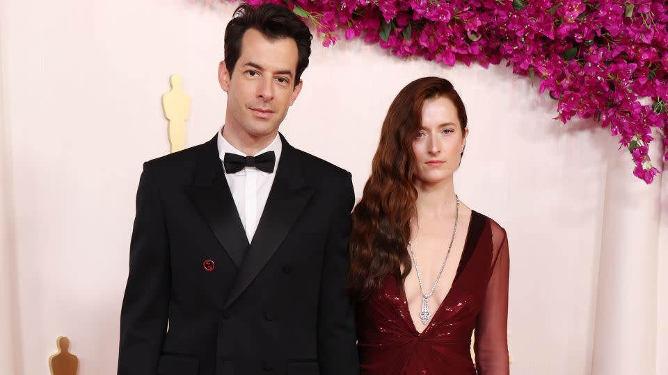 Best Original Song nominee (for “I’m Just Ken”) Mark Ronson wore a classic double-breasted Gucci suit. His wife Grace Gummer opted for a plunging Gucci red gown and Briony Raymond jewelry. - Kevin Mazur/Getty Images