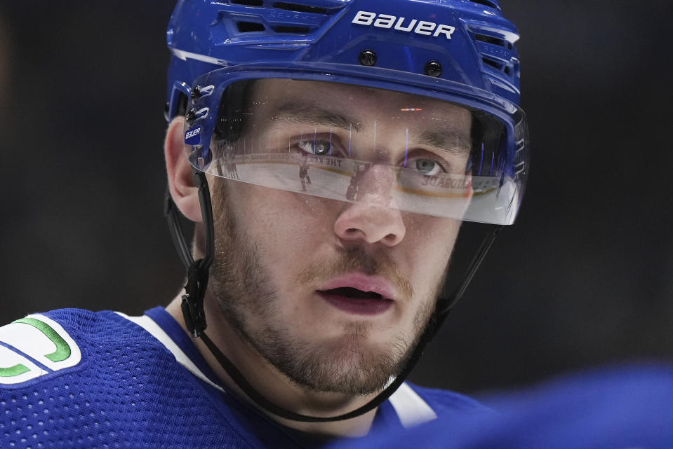 Vancouver Canucks' Bo Horvat prepares to take a faceoff against the Colorado Avalanche during the first period of an NHL hockey game Thursday, Jan. 5, 2023, in Vancouver, British Columbia. (Darryl Dyck/The Canadian Press via AP)