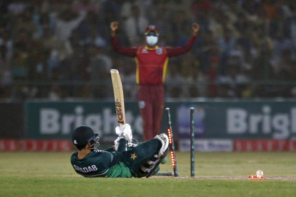 Pakistan's Shadab Khan reacts as he is bowled out by West Indies' Jayden Seales during the third one-day international cricket match between Pakistan and West Indies at the Multan Cricket Stadium, in Multan, Pakistan, Sunday, June 12, 2022. (AP Photo/Anjum Naveed)