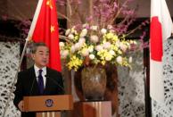 Chinese Foreign Minister Wang holds joint news announcement with Japanese counterpart Motegi