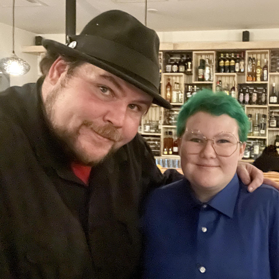 Heide and Ollie in front of the bar the teen helped design inside the restaurant. (Courtesy Dave Heide )