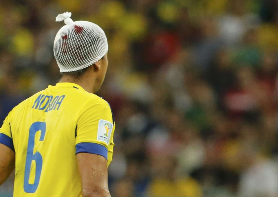 Ecuador's Cristian Noboa is seen with a bandage on his head, following a collision earlier, during their 2014 World Cup Group E soccer match against France at the Maracana stadium in Rio de Janeiro June 25, 2014. REUTERS/Sergio Moraes (BRAZIL - Tags: SOCCER SPORT WORLD CUP TPX IMAGES OF THE DAY)