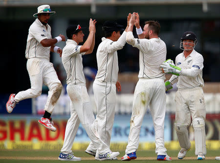 Cricket - India v New Zealand - First Test cricket match - Green Park Stadium, Kanpur, India - 22/09/2016. New Zealand's players celebrate after taking the wicket of India's Ajinkya Rahane. REUTERS/Danish Siddiqui