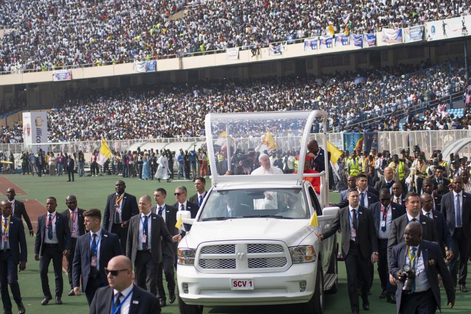 Pope Francis on the popemobile, waves at worshipers at the Martyrs’ Stadium in Kinshasa, Congo, Thursday Feb. 2, 2023. Pope Francis urged Congo’s young people to work for a peaceful and honest future on Thursday, getting a raucous response from a generation that has been particularly hard-hit by the country’s chronic poverty, corruption and conflict. (AP Photo/Samy Ntumba Shambuyi)