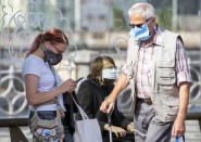 People wearing face masks as they wait at a train station in Prague, Czech Republic, Thursday, Sept. 17, 2020 The number of new confirmed coronavirus infections have hit a record in the Czech Republic, surpassing 2,000 cases in one day for the first time. (Sulova Katerina/CTKvia AP)