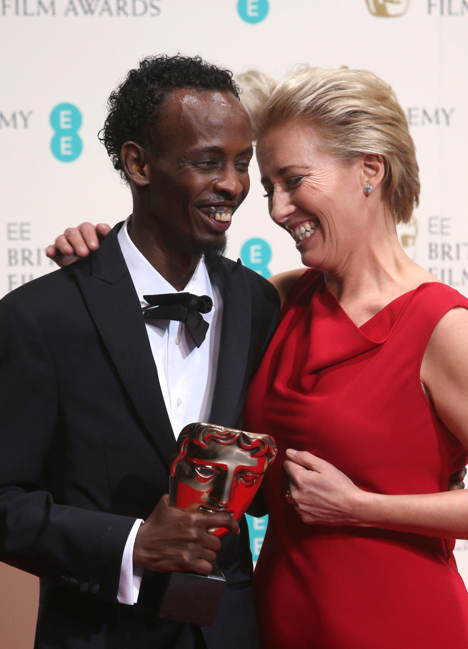 Barkhad Abdi, winner of best supporting actor and Emma Thompson pose for photographers in the winners room at the EE British Academy Film Awards held at the Royal Opera House on Sunday Feb. 16, 2014, in London. (Photo by Joel Ryan/Invision/AP)