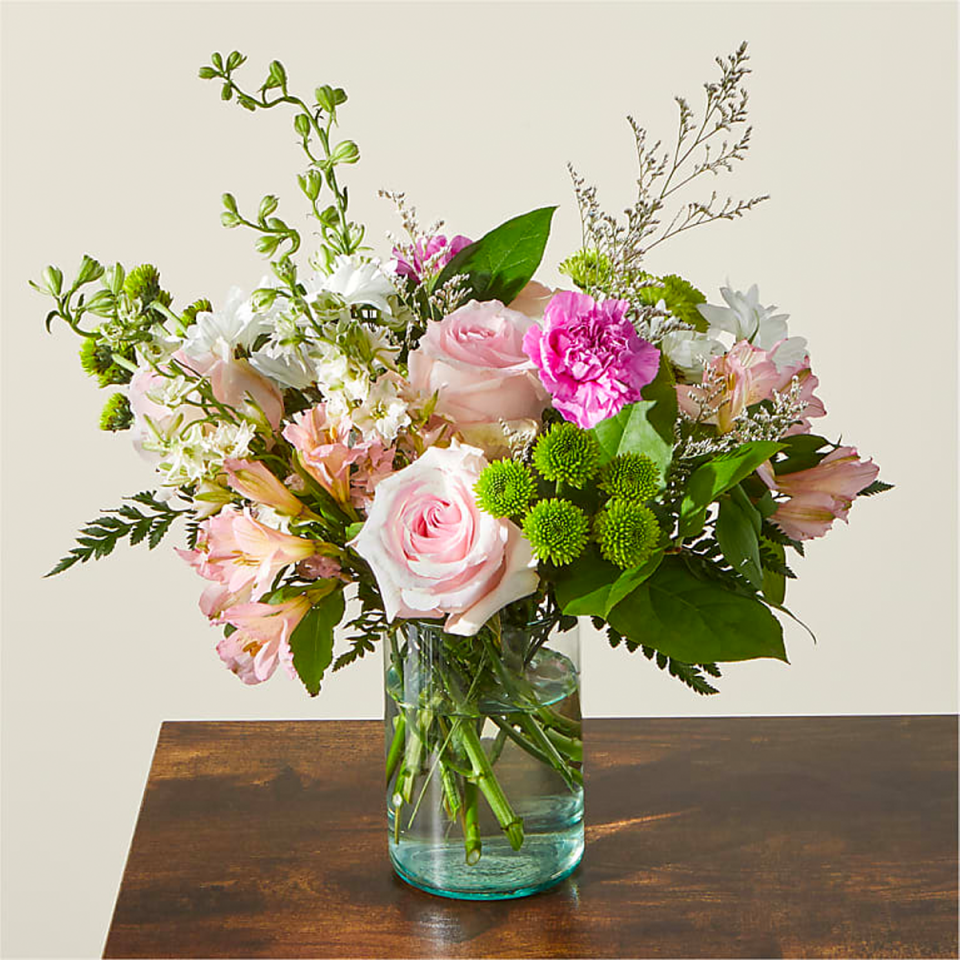 Elegant and elevated, this pink-and-green floral arrangement would look great in any home. And since you can opt for same-day delivery in much of the United States and next-day delivery in dozens of countries worldwide, it can actually reach any home you want. $63, Happy Together Bouquet. <a href="https://www.ftd.com/product/happy-together-bouquet-prd-f5454" rel="nofollow noopener" target="_blank" data-ylk="slk:Get it now!" class="link ">Get it now!</a>