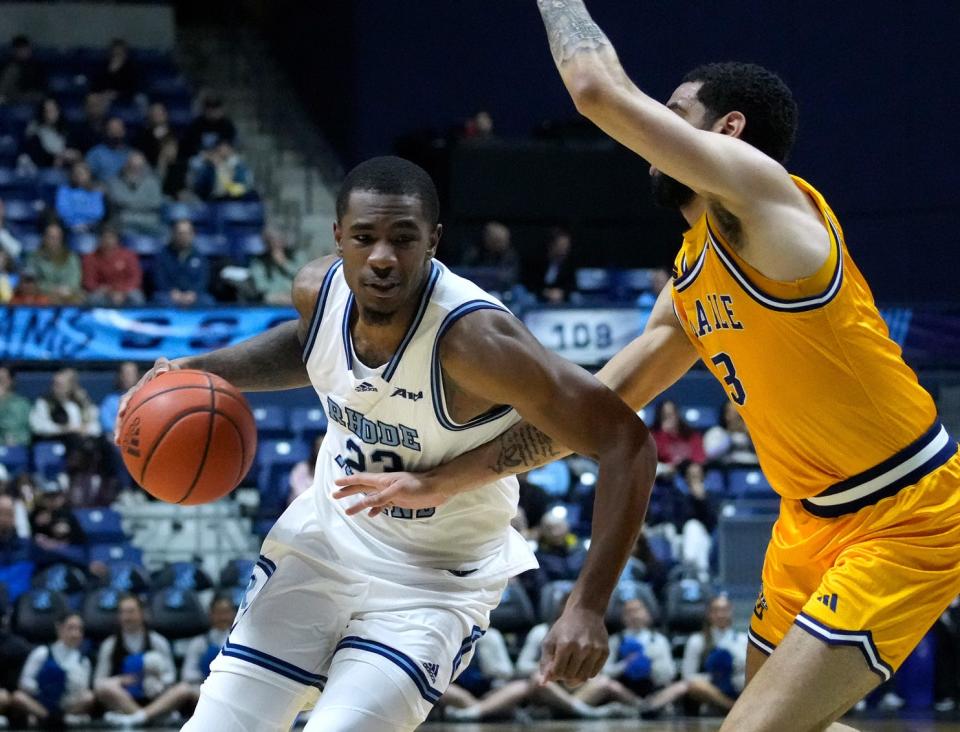 URI forward David Green drives to the hoop against La Salle's Daeshon Shepherd.