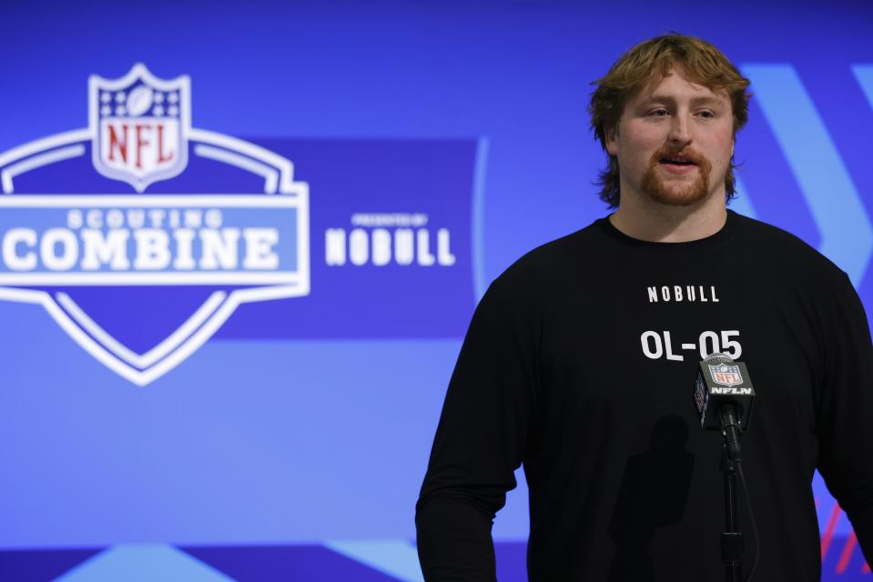 Karsen Barnhart of Michigan speaks to the media during the NFL combine, March 2, 2024 in Indianapolis.