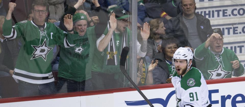 Dallas Stars center Tyler Seguin (91) celebrates his goal against the Vancouver Canucks during the third period of an NHL hockey game Saturday, March 28, 2015, in Vancouver, British Columbia. (AP Photo/The Canadian Press, Jonathan Hayward)