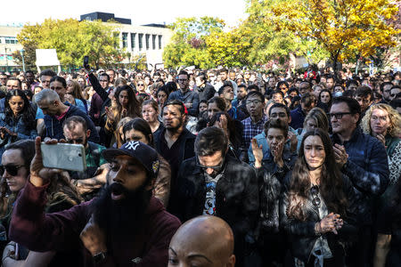 Workers stand outside 14th street park after walking out as part of a global protest over workplace issues in New York, U.S., November 1, 2018. REUTERS/Jeenah Moon