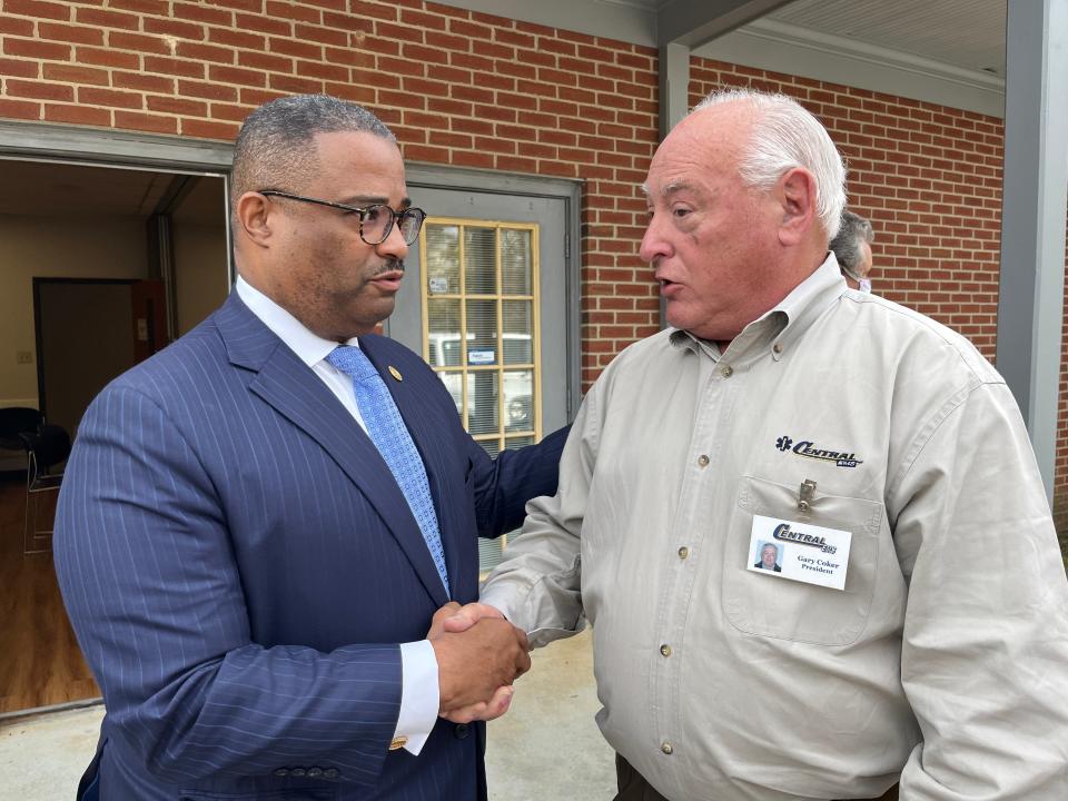 Mayor Garnett Johnson, left, and Central EMS president Gary Coker shake hands shortly after Central was tentatively approved as Augusta's new zone provider in a Region 6 Zoning Committee Meeting in Augusta, GA on Wednesday, Feb. 15, 2022.