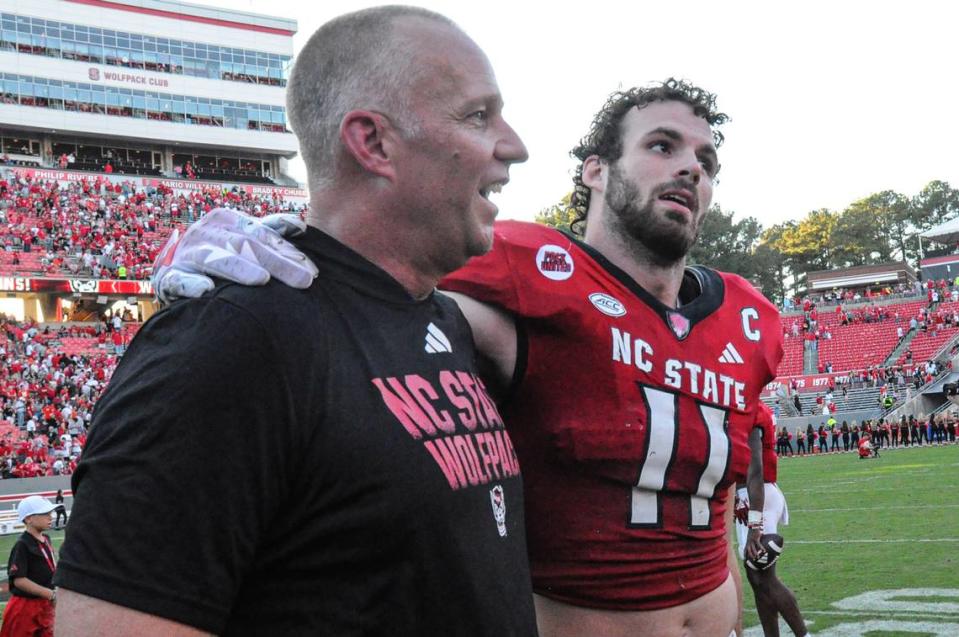 Oct 28, 2023; Raleigh, North Carolina, USA; North Carolina State head coach Dave Doeren and linebacker Payton Wilson (11) after a game against the Clemson Tigers at Carter-Finley Stadium. North Carolina State won 24-17.