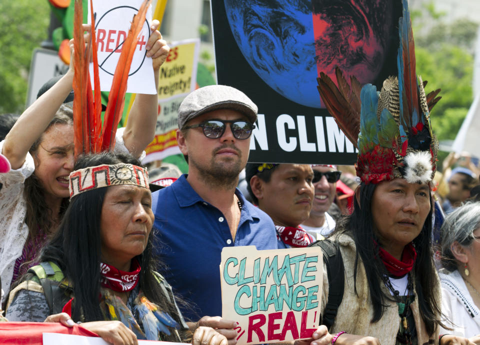 US actor Leonardo DiCaprio marches with a group of indigenous people from North and South America, during the People's Climate March in Washington DC, on April, 29, 2017