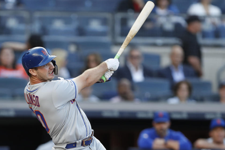 New York Mets' Pete Alonso watches his three-run home run during the first inning of the team's baseball game against the New York Yankees, Tuesday, June 11, 2019, in New York. (AP Photo/Kathy Willens)