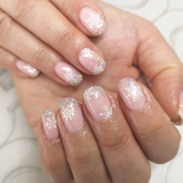 <p>These snowflake nails are basically pure winter, right? Keep your colors sheer—just an iridescent neutral nail polish with a few sheer swipes of <a href="https://www.amazon.com/OPI-Tinsel-Lil-Star-0-5/dp/B08BJLS3NM/?tag=syn-yahoo-20&ascsubtag=%5Bartid%7C10049.g.30065321%5Bsrc%7Cyahoo-us" rel="nofollow noopener" target="_blank" data-ylk="slk:silver polish;elm:context_link;itc:0;sec:content-canvas" class="link ">silver polish</a> at the tips—then stick on a <a href="https://www.julep.com/products/snowflakes-1?variant=14510277820451" rel="nofollow noopener" target="_blank" data-ylk="slk:snowflake decal;elm:context_link;itc:0;sec:content-canvas" class="link ">snowflake decal</a> and cover with a top coat.</p><p><a href="https://www.instagram.com/p/B5htpDslh7Q/" rel="nofollow noopener" target="_blank" data-ylk="slk:See the original post on Instagram;elm:context_link;itc:0;sec:content-canvas" class="link ">See the original post on Instagram</a></p>