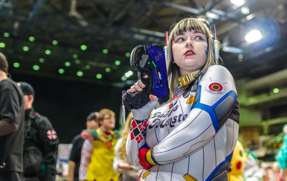 Cosplayer dressed as a mashup cosplay of 'D.Va' from the video game Overwatch and Harley Quinn from DC Comics at the Yorkshire Cosplay Con at Sheffield Arena.