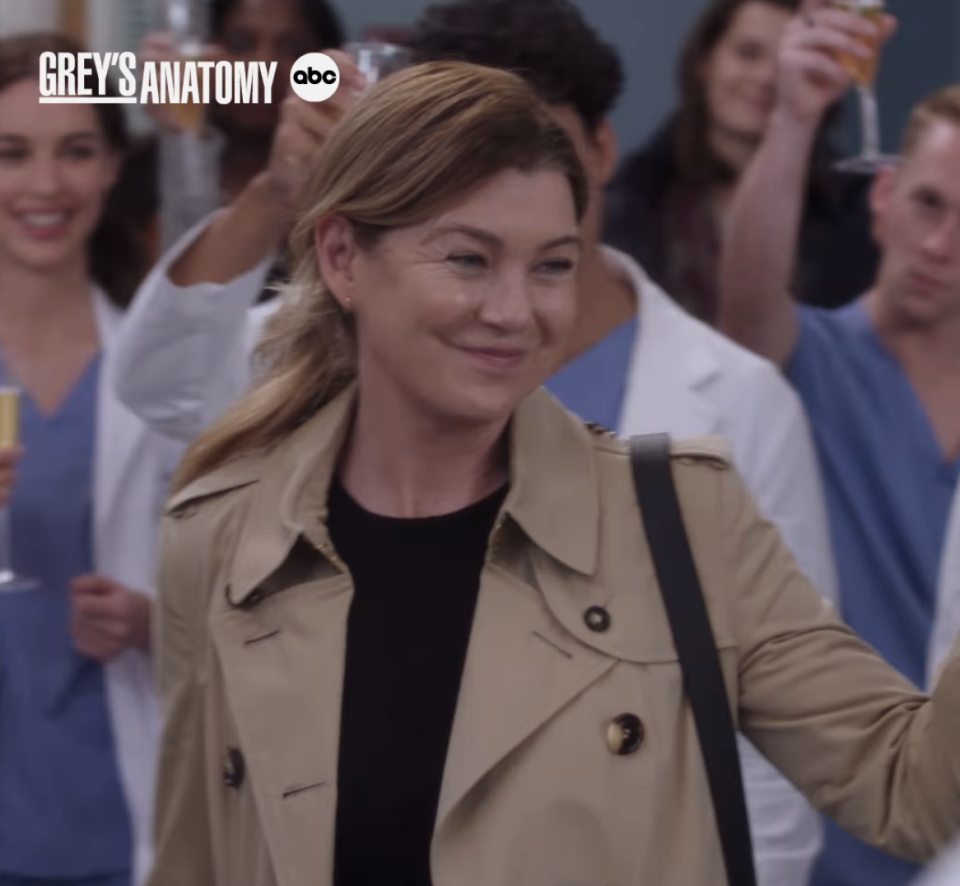 Meredith smiling and waving