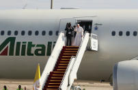 Pope Francis boards a plane upon concluding his visit to Iraq at Baghdad airport, Iraq, Monday, March 8, 2021. (AP Photo/Khalid Mohammed)