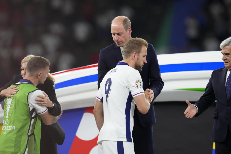 Britain's Prince William greets England's Harry Kane after the final match between Spain and England at the Euro 2024 soccer tournament in Berlin, Germany, Sunday, July 14, 2024. Spain won 2-1. (AP Photo/Manu Fernandez)