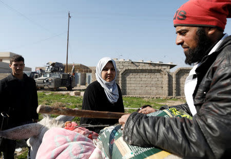 A couple, who just fled the village controled by Islamic State militants, is pictured in Albu Saif, which was recently retaken by Iraqi military forces, south of Mosul, Iraq February 22, 2017. REUTERS/Zohra Bensemra