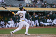 Oakland Athletics' Brent Rooker watches his two-run home run against the Miami Marlins during the third inning of a baseball game Saturday, May 4, 2024, in Oakland, Calif. (AP Photo/Godofredo A. Vásquez)