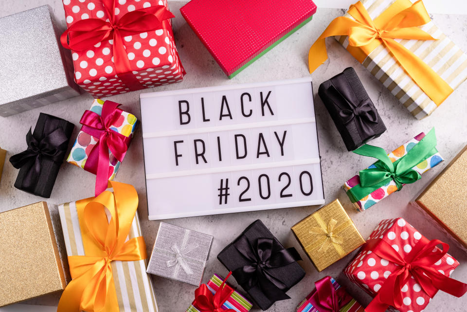 Black Friday concept. Black friday Sale 2020 text words on lightbox with various gift boxes top view flat lay