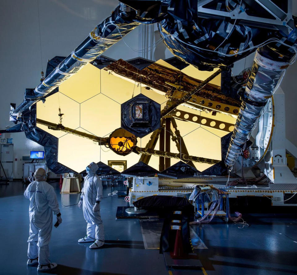 Runner up: Technicians and engineers inspect the support structure holding one of the James web space telescope mirrors in place