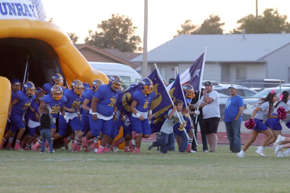 Sunray Bobcats enter the field for a District 1-2A Division II game against Boys Ranch on Friday, Oct. 14, 2022, at Bobcat Stadium in Sunray,