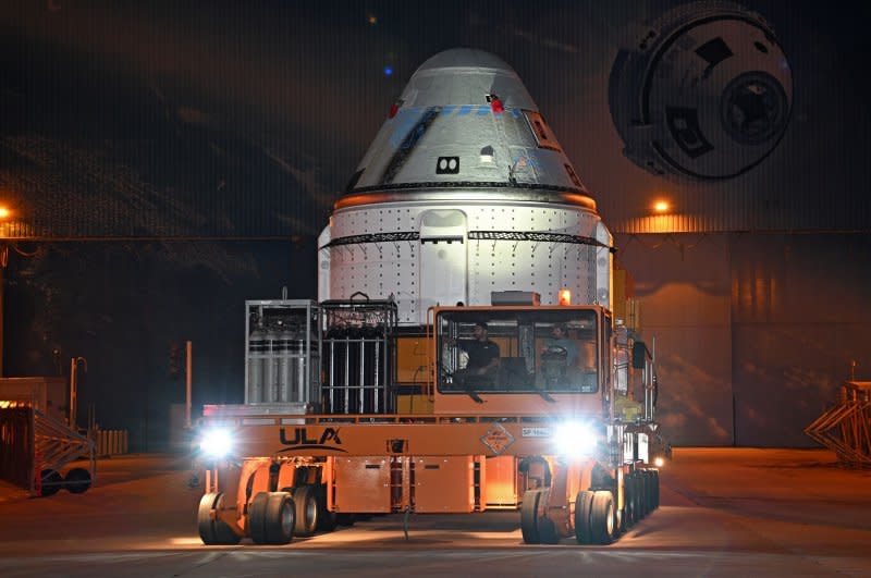 Boeing rolls out its Starliner spacecraft from the Commercial Crew and Cargo Processing Facility at the Kennedy Space Center on April 16. Photo by Joe Marino/UPI