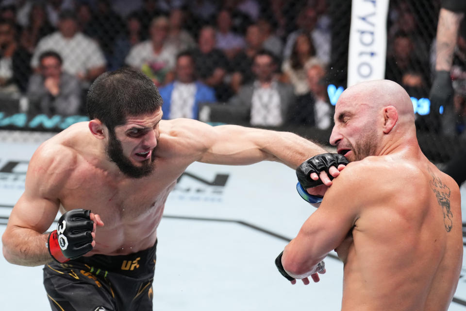 Islam Makhachev (left) punches Alexander Volkanovski in the UFC lightweight championship fight at UFC 284 on February 12, 2023 in Perth, Australia. (Photo by Chris Unger/Zuffa LLC via Getty Images)