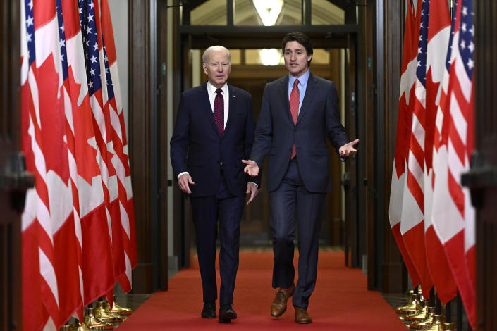 Prime Minister Justin Trudeau and U.S. President Joe Biden arrive to an official welcome ceremony on Parliament Hill, in Ottawa, Canada, on Friday, March 24, 2023. (Justin Tang/The Canadian Press via AP)