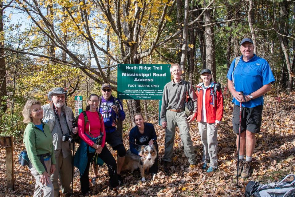 Priscilla Spitzer, from left, Ray Smith, Jennifer Miller, Wiley Peck, Sharon Rivers, Richard Baylor, Becky Gibson, and Steve Oliphant at the Mississippi Road access to the North Ridge Trail.