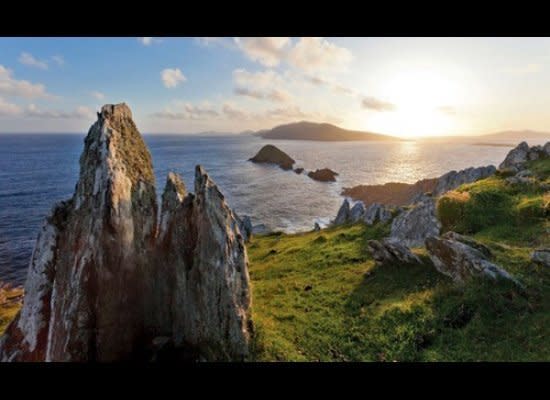 Experience a portion of the rugged <a href="http://www.ireland.com/en-au/what-is-available/natural-landscapes-and-sights/articles/wild-atlantic-way" target="_hplink">Wild Atlantic Way</a> on a hair raising drive along the Dingle Peninsula’s craggy <a href="http://www.dingle-peninsula.ie/" target="_hplink">Conor Pass</a>. This ribbon of road cut into the side of a mountain is a harrowing and heroic experience offering, at one point, a panorama of both Dingle Bay to the south and Tralee Bay to the north — both far below your boots or tires. Wooly sheep dot the County Kerry landscape of <a href="http://www.dingle-peninsula.ie/" target="_hplink">Dingle’s Slea Head Drive</a>, which juts out into the Atlantic high above Ireland’s lonely westernmost point and offers both beach- and cliff-side experiences. Nearby, the <a href="http://www.ringofkerrytourism.com/" target="_hplink">Ring of Kerry</a> scenic loop — potentially done as a 105-mile day trip from Killarney and back, though better done in stages — dips in the out of villages such Kenmare and the placid Watervillle for strolling and shopping. Or, for mini road trippers, <em><a href="http://www.adventuresbydisney.com/europe/ireland-vacations/?CMP=VAN-ABDBrochureIreland" target="_hplink">Adventures by Disney</a></em>'s® Ireland tour is a rollicking adventure encompassing Dromoland Castle, Dublin, the Rock of Cashel, the Cliffs of Moher and more.