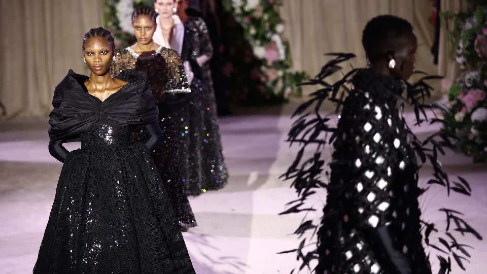 Regal evening gowns were everywhere at Richard Quinn. - Henry Nicholls/AFP/Getty Images