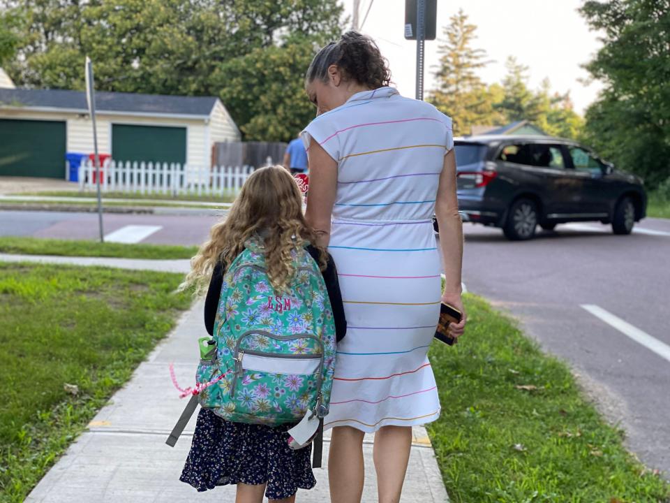 Trisha Shrum talks daughter Eleanor Shrum Myers, through her first day jitters as they walk to C.P. Smith Elementary School to begin Eleanor's second grade year, Aug. 25, 2021.