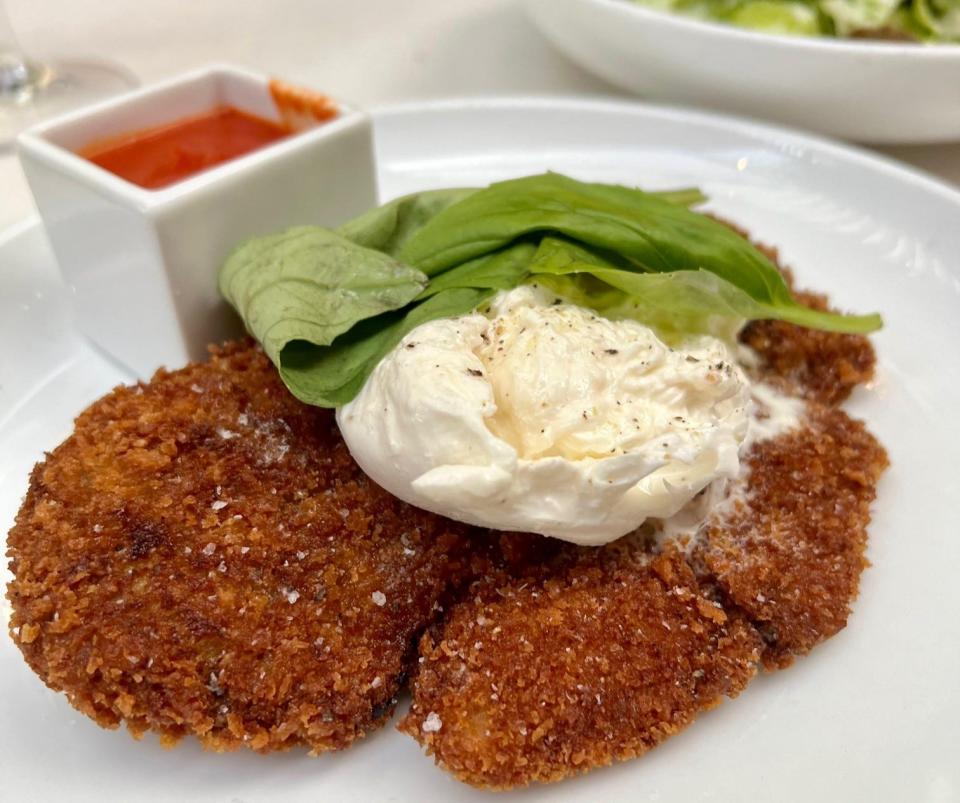 On the menu at the new NiMo Mediterranean restaurant in Tequesta: crispy Kai-Kai Farm eggplant with burrata, pomodoro and basil.