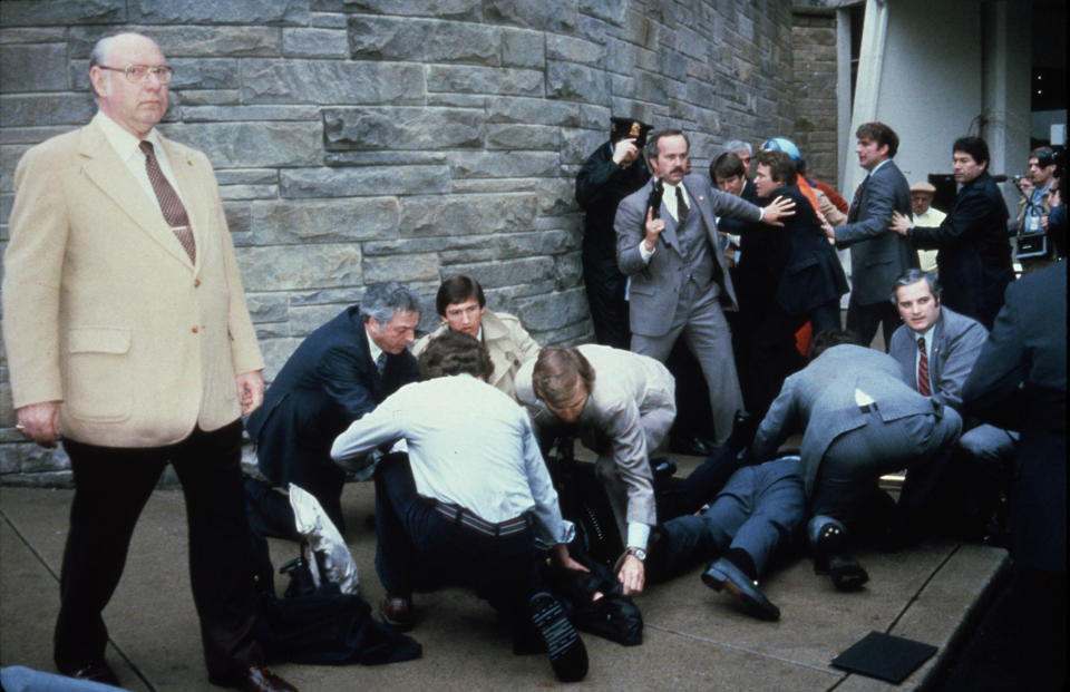 Chaos surrounds shooting victims immediately after the assassination attempt on President Ronald Reagan on March 30, 1981, by John Hinckley Jr. outside the Hilton Hotel in Washington, D.C. / Credit: Getty Images