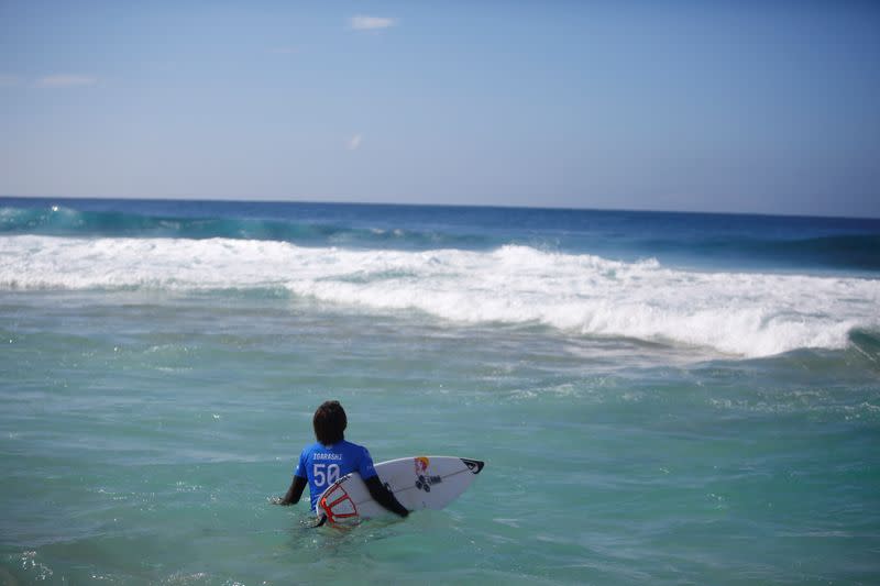 FILE PHOTO: Surfer Kanoa Igarashi prepares for his heat at the Billabong Pipe Masters at the Banzai Pipeline in Pupukea on the island of Oahu