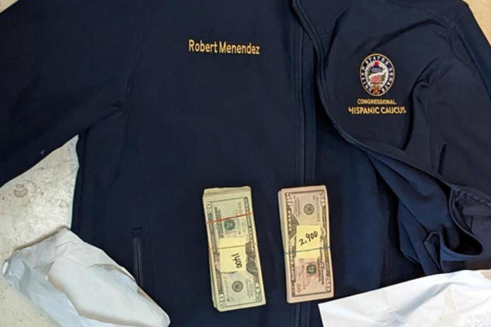 A jacket bearing Senator Menendez's name, along with cash found inside the jacket during a search by federal agents ((U.S. Attorney's Office via AP))