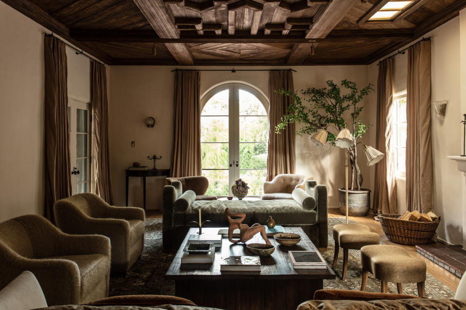 An earthy living room with limewash walls in taupe color