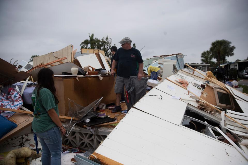 John Finelli, a resident of the Tropicana Mobile Home Park searches for belongings after a tornado destroyed his home on Sunday Jan. 16, 2022. His parents were in the home and were transported to the hospital.