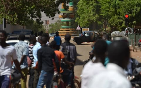 Witnesses said five armed men got out of a car and opened fire on passersby before heading towards the embassy in the centre of the city - Credit: AHMED OUOBA/AFP/Getty Images