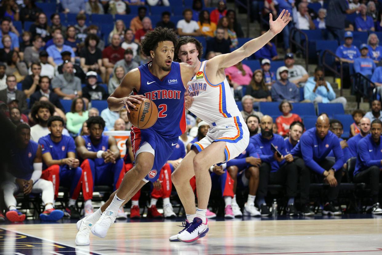 Detroit Pistons guard Cade Cunningham (2) drives the baseline as Oklahoma City Thunder guard Josh Giddey (3) defends at BOK Center in Tulsa, Oklahoma, on Thursday, Oct. 19, 2023.